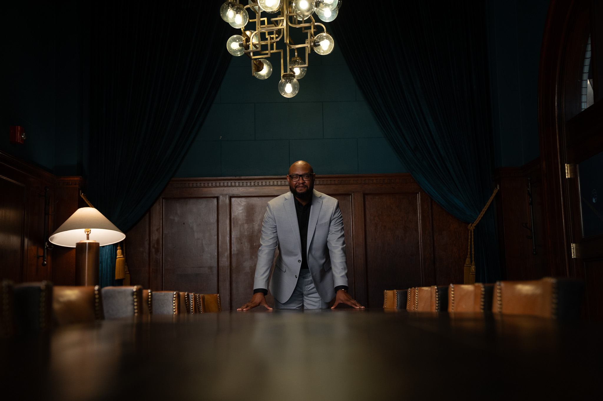 Jerry Johnson standing at the head of a boardroom table